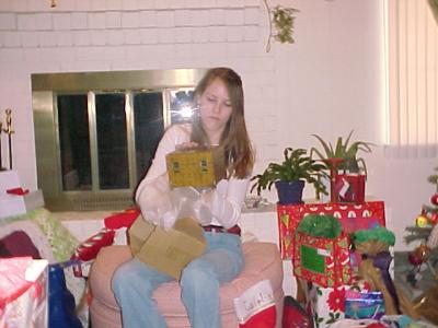 Caitlin opening her present from Tarrant & Cassie